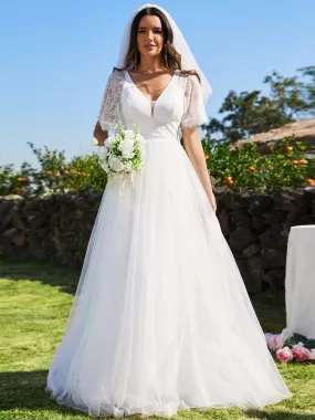 Robe de mariée en tulle avec col en V et manches plissées