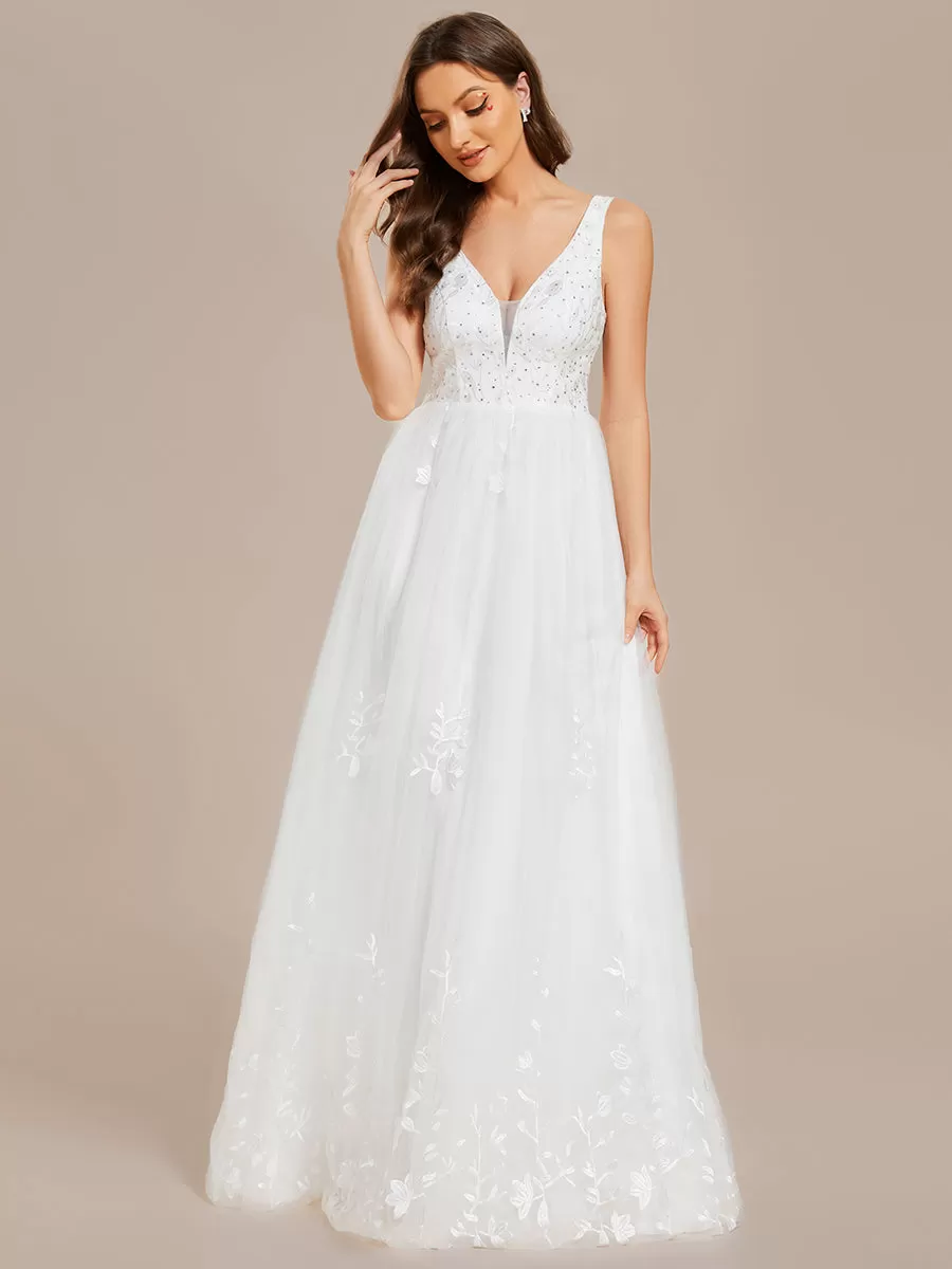 Robe de mariée trapèze brodée sans manches à col en V