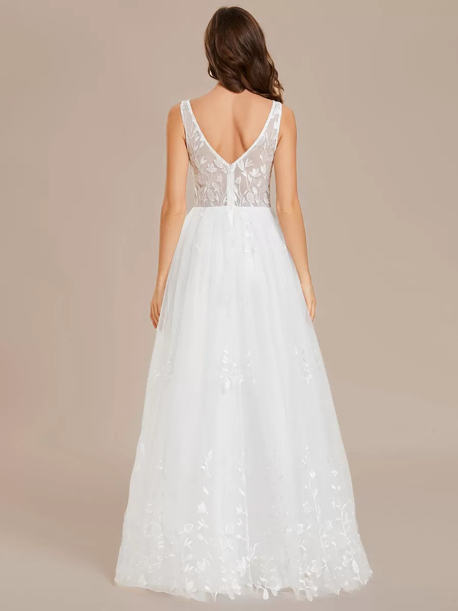 Robe de mariée trapèze brodée sans manches à col en V